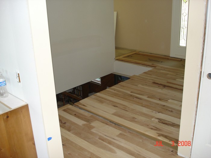 The front hall with out a banister.  It has been cool living downstairs, thank goodness!