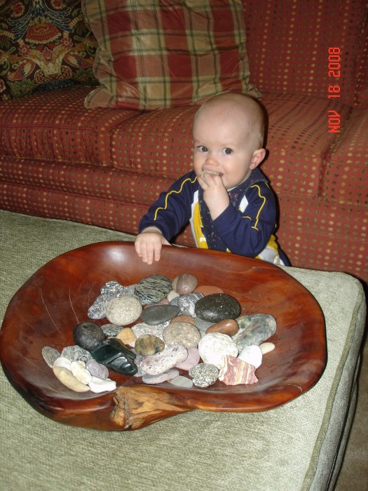 Steven is about to walk so I am teaching him how to identify rocks!