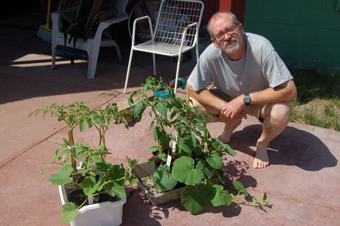 Here's the tomatoes and squash that we have been ferrying in and out of the house while waiting for suitable temperatures