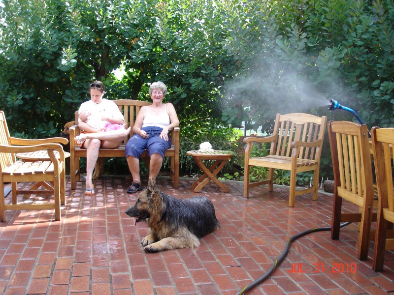 Grandma put the hose on Mist to cool off the patio and Keshia loved it.  Sat right down in it.  It was in the high 90's.