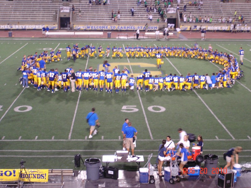 After the game the team gathers for a prayer.  Jordan is No. 30, on the right.