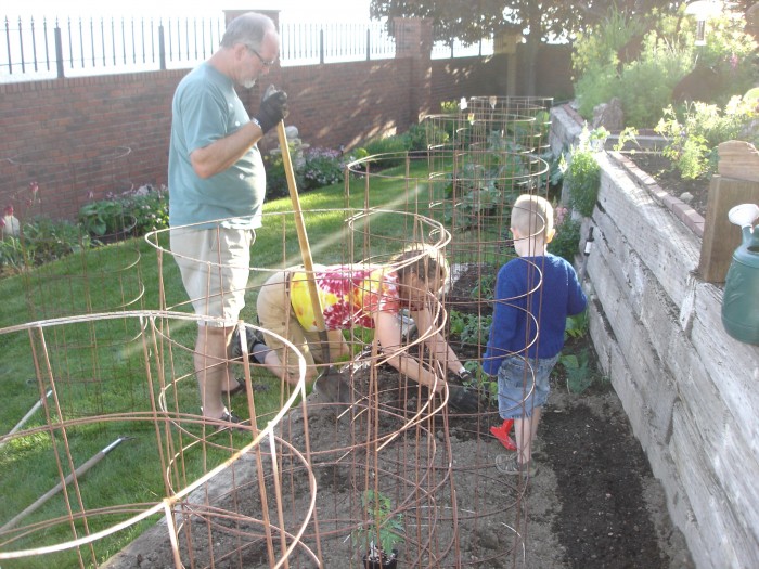 C &amp; A dug up the gardens, then turned in our compost, some gypsum, and some mulch, raked it, and on Monday we planted tomatoes, squash, beans, beets, zucchini, and Mom planted her tubs and flowers.  Dad supervised!