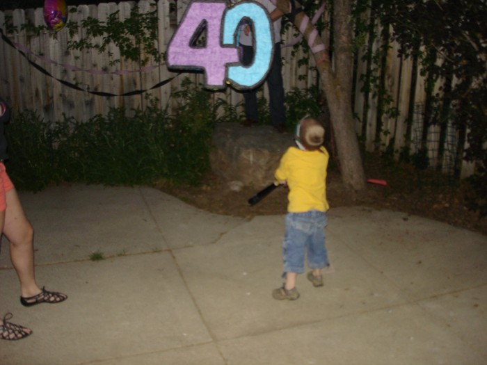 The party ended with the (breaking) of the pinata full of candy.  I think Jason finally had to do the heavy work here.