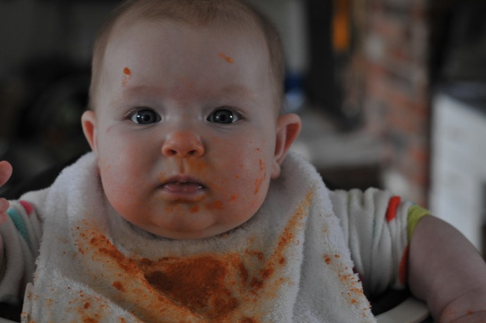 She is starting to eat solid foods and loves almost everything.