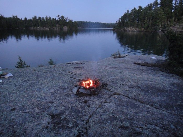 The camp fire burning down on our island camp in Crow Lake