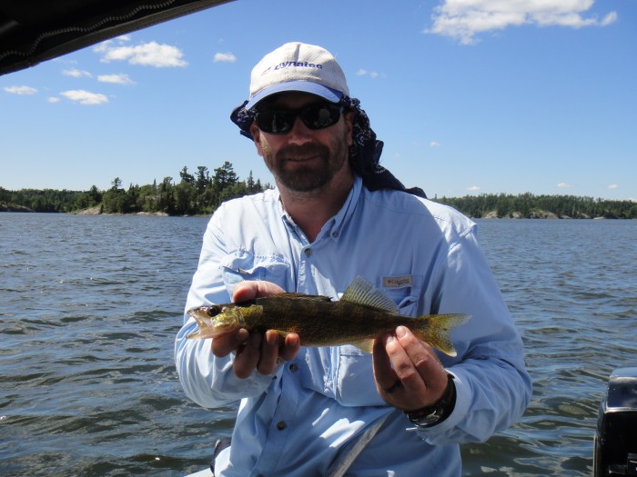 Jason with a representative walleye from Lake of the Woods.