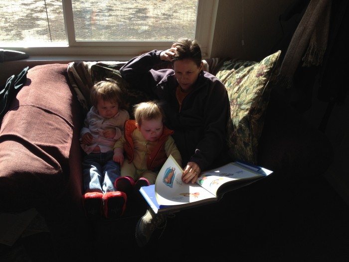 Ann reading to Mathilda and Amanda