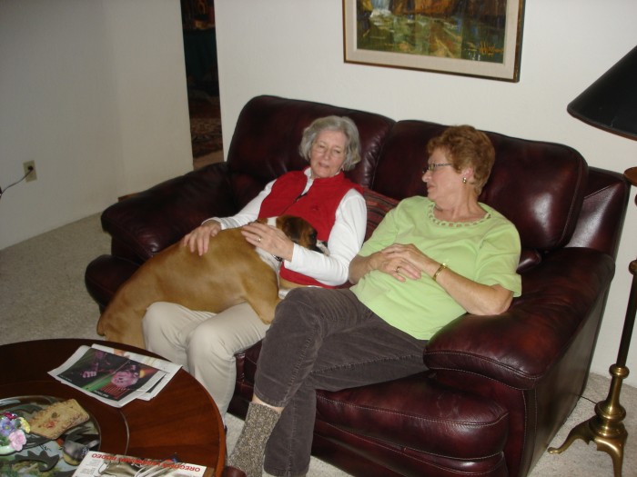 Sue Bates and her boxer in Medford.  Judy loves a nice lap dog!