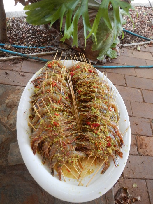 This method of skewering makes them easy to cook, ginger, galangal, tumeric root, chili and lime all from the garden.