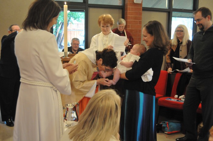 Zoila did the baptism and here she is blessing Winston's feet.