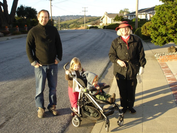 Mathilda has a half-skateboard attached to the stroller so she can ride along.