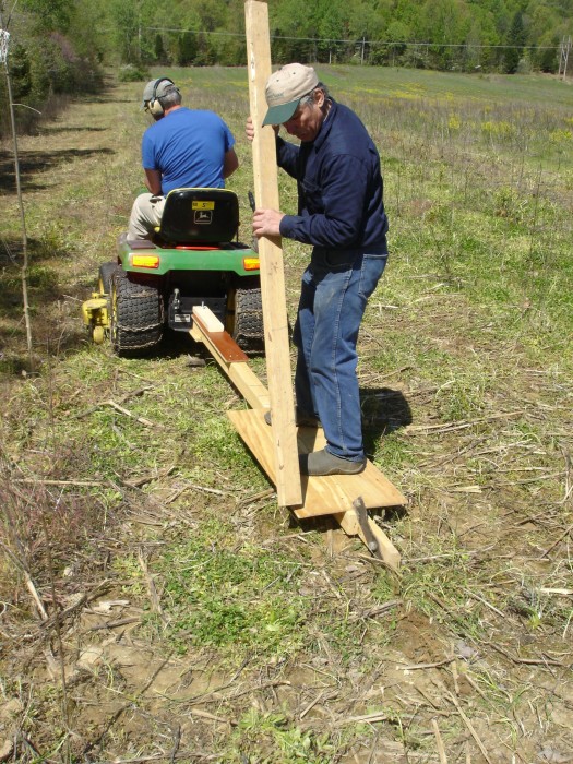 Jon planted a hedge row of Hedge Apples.  Here they are making a furrow for the seeds.