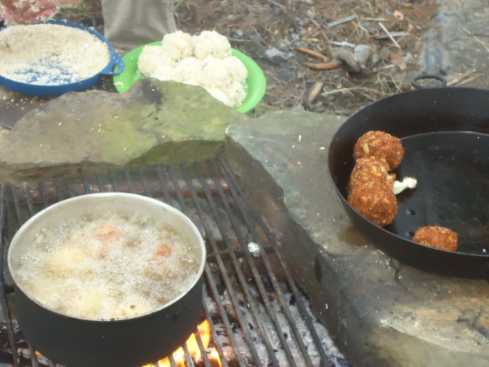 Production of curried fish balls.  This operation was a bit of a fire hazard with boiling oil over an open fire. At least there was plenty of water nearby.....