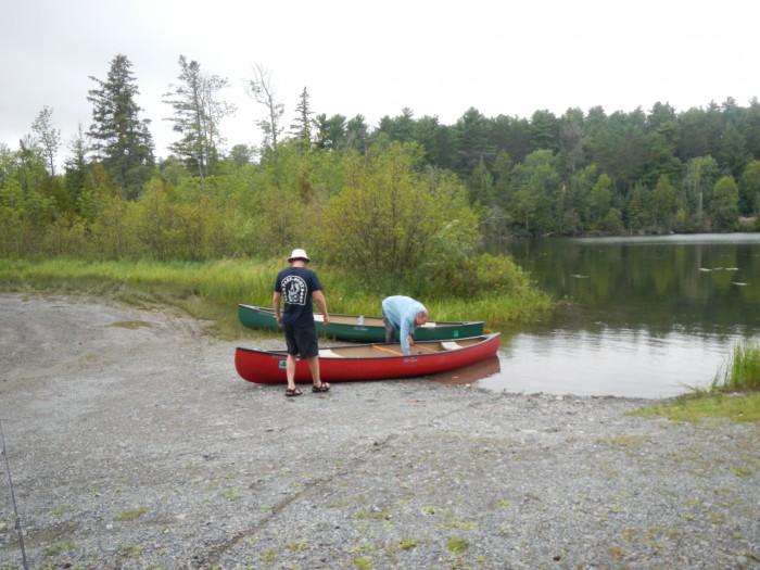 Cleaning out the canoe at the end of the trip