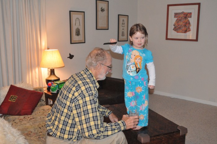 Mathilda combing grandpa's hair