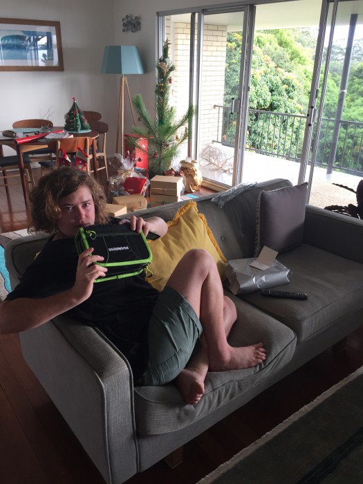 Emma w cool mini tackle box from Santa, best christmas tree ever (!) in background.