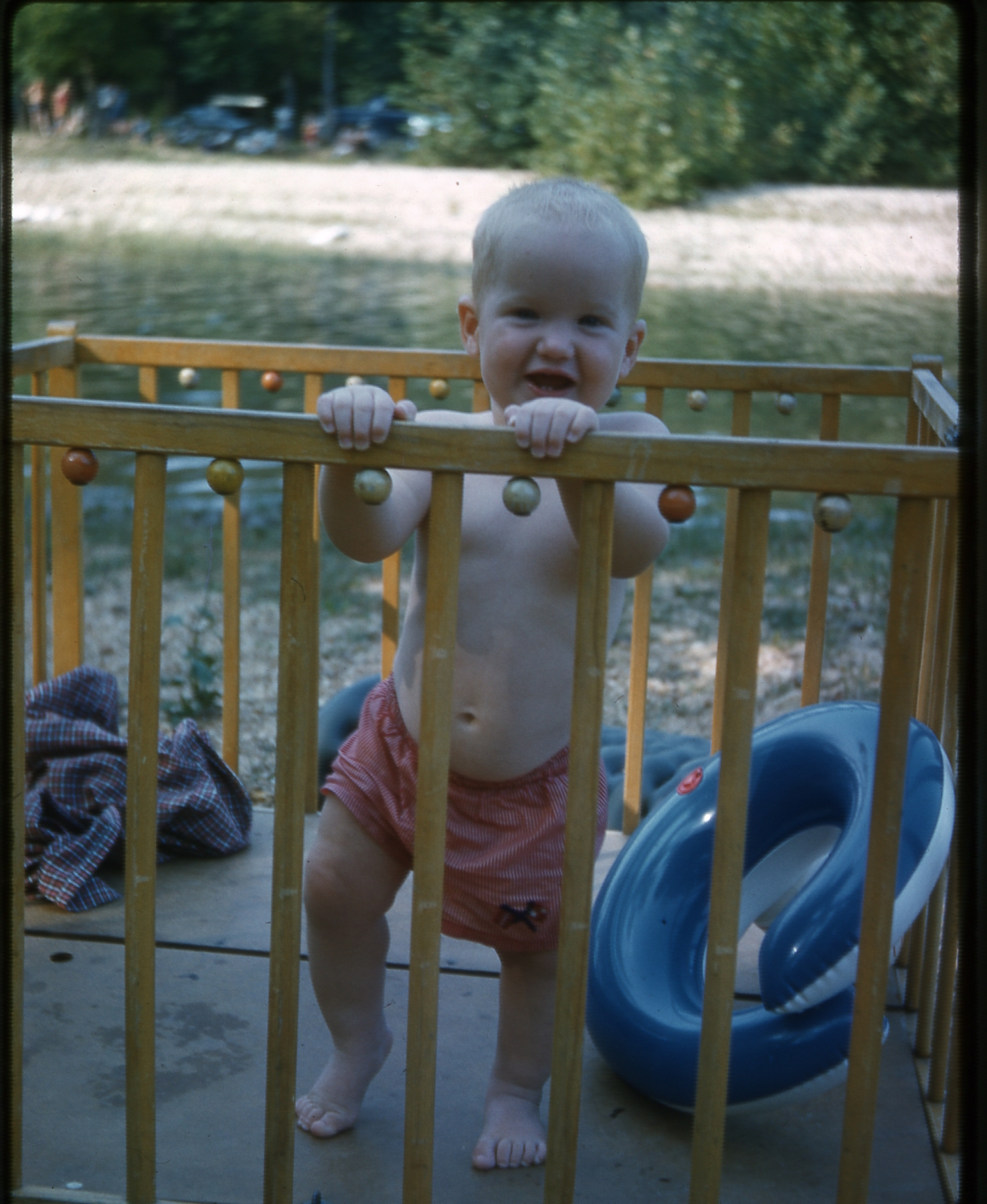 Missouri, 1960:  Already a happy kid, on the bar at the Blue Hole.