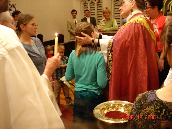 Deirdre being anointed after her Baptism.