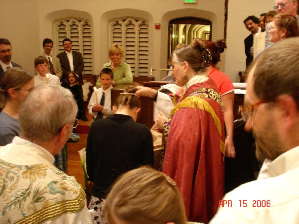 Michaela being Baptised with the water.