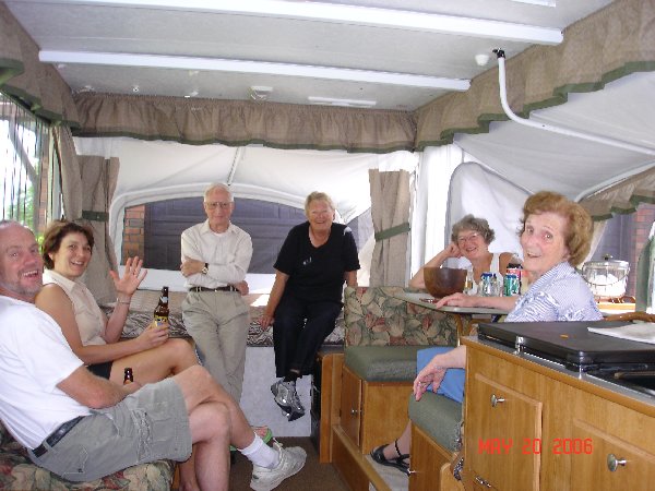 We had a neighborhood open house in our new tent trailer before we took it out the first time.  Even the Postie came to visit!  The couple on the left are now in the Saballa house.