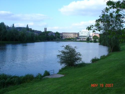 Philippe lives a short block above the central lake at LLN, and the town center is at the far end.